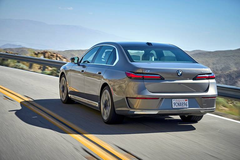 BMW i7 (2023) driving, rear view